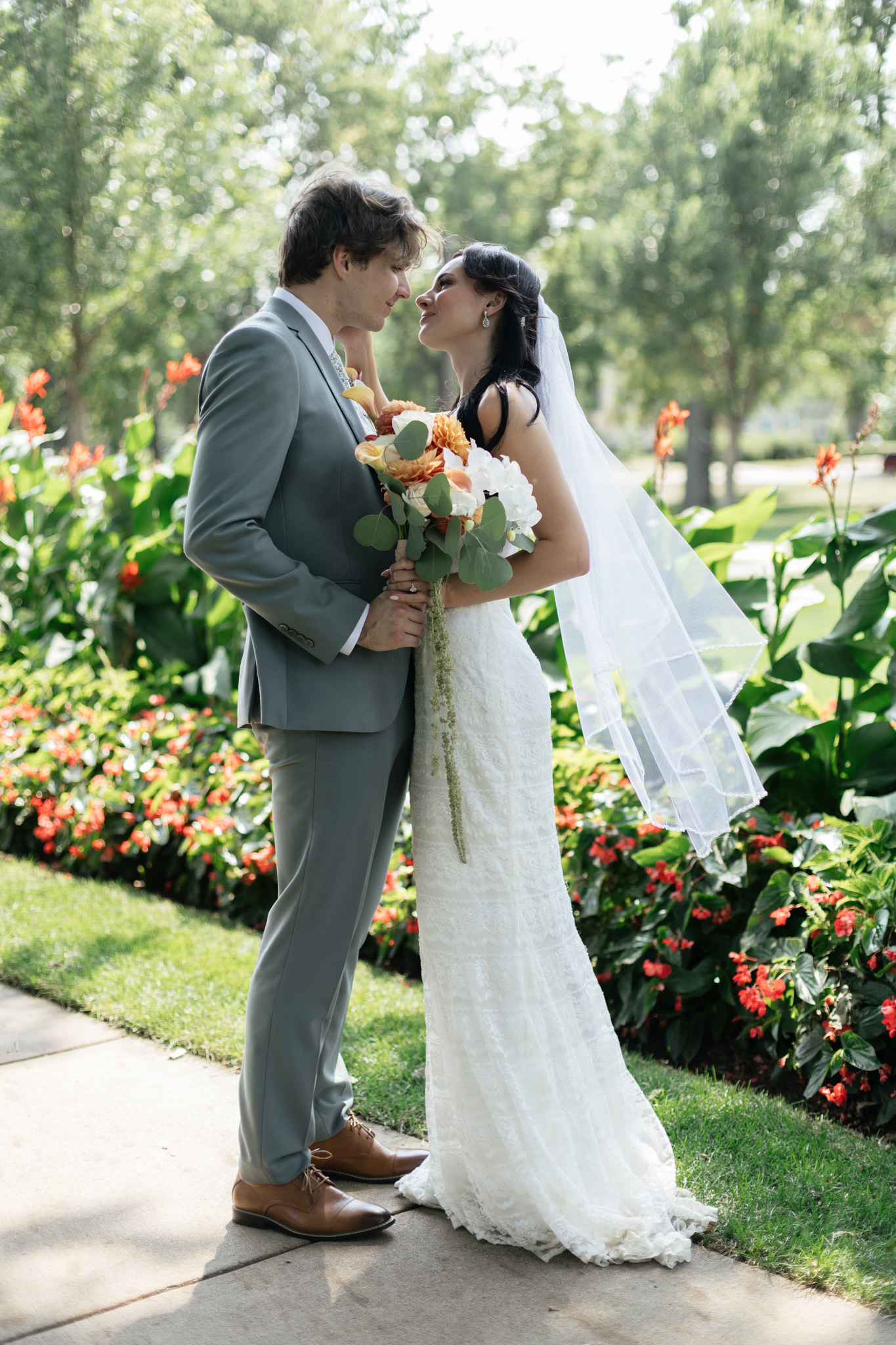 Sayje and Emanuel posing as newlyweds in the Sunken Gardens at McKennan Park in Sioux Falls, South Dakota
